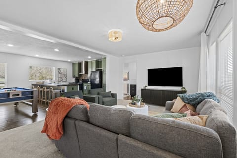 Hang out in the spacious living area, where comfortable seating, a large TV, and an open layout create the perfect spot for unwinding and enjoying time together.