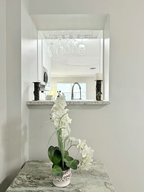 The second living room is more private, with a single sofa, 2 chairs, and a TV