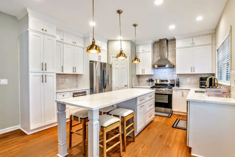 Kitchen with fully stocked cooking utensils/cookware with Eat In counter