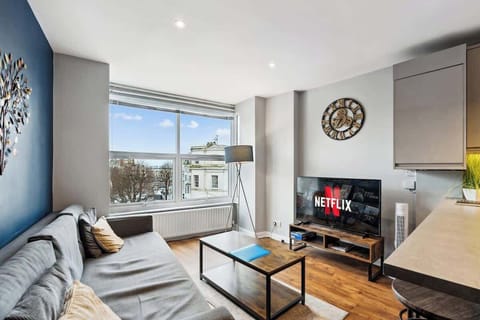 Bright, light-filled living space with a warm, airy feel. Designed to make the most of natural light, with comfortable seating and an easy, relaxed layout.