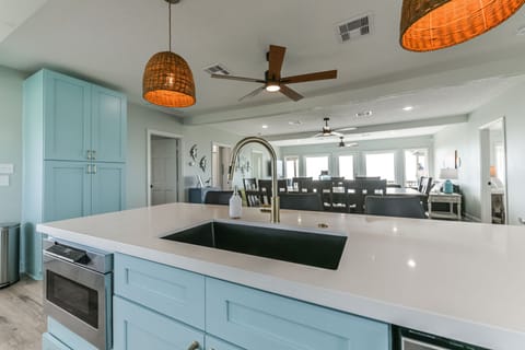 Kitchen sink overlooking the living room and dining room table so you won't miss anything that goes on while cooking. (Upstairs)