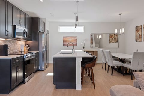 Open-concept kitchen with stylish finishes—perfect for group gatherings.
