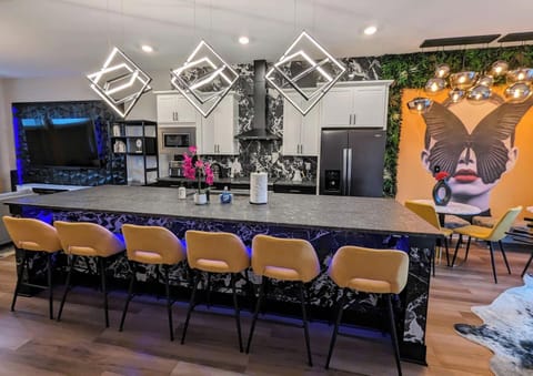 Townhouse 1: Cook, connect, and relax—all in one seamless space. This open-concept kitchen and living area is perfect for entertaining, with natural light pouring in.