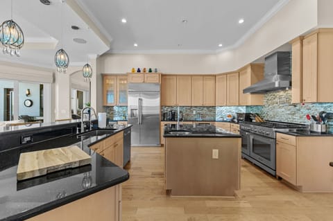 Culinary perfection! Enjoy premium appliances, ample cooking space, and a sleek island.