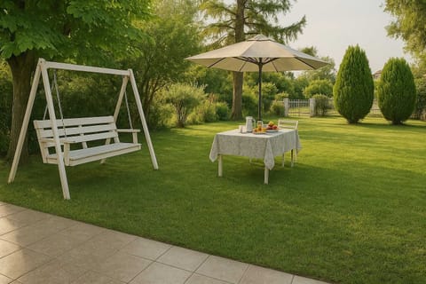Lush Garden with Outdoor Swing & Lawn Space
Expansive green garden featuring a cozy swing and ample space for children to play or adults to relax.
