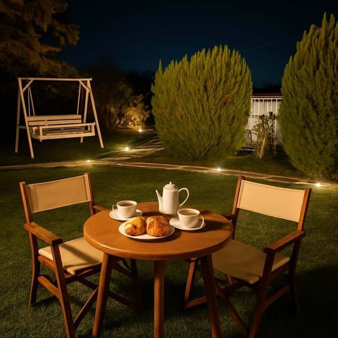 Romantic Garden Dining by Night
Soft garden lighting creates a cozy evening ambiance for outdoor meals or drinks under the stars.