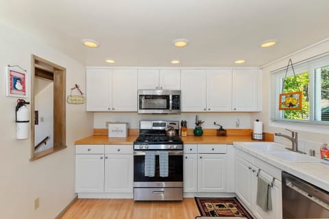 The open kitchen offers ample space & every home comfort