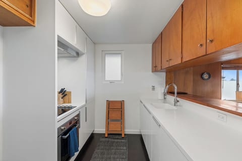 Kitchen with stove, dishwasher, french press coffee maker