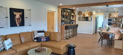 Spacious open-concept living with bar, lounge, and dining in wine country.