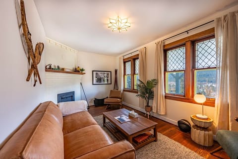 Relax in this cozy living room, where a warm fireplace and comfortable seating make the perfect spot to unwind.