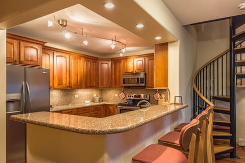 Kitchen Counter with 3 Bar Stools