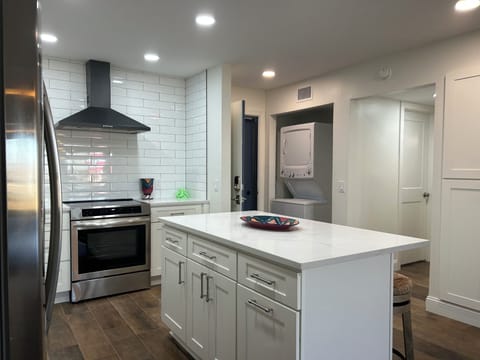 Kitchen showing laundry space.