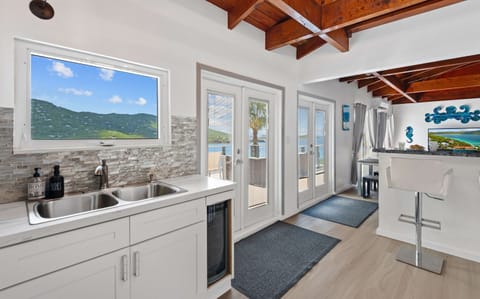 When you enter off of the wrap around balcony, you step into the kitchen and living room space.