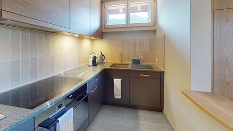 Kitchen with coffee machine, oven, dishwasher etc.