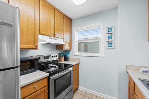 Fully Stocked Kitchen with Bar Seating