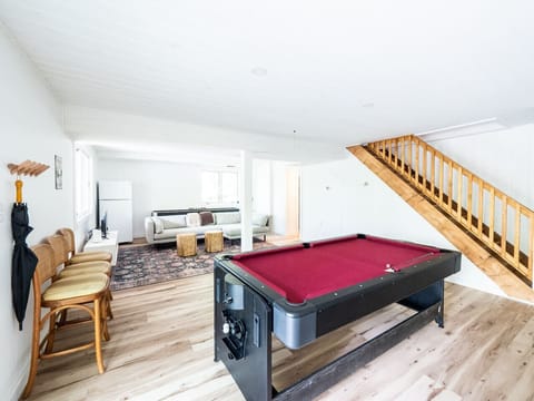 Game room with pool / ping pong and shuffleboard. Large smart TV also downstairs for movie nights