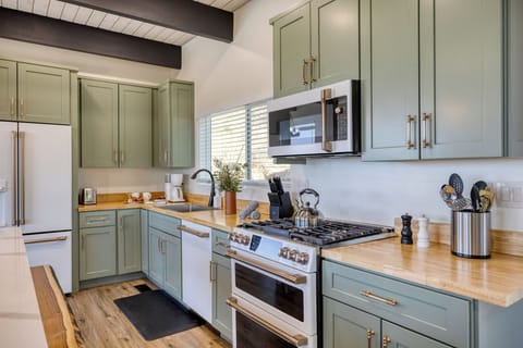 Fully stocked with utensils and appliances.