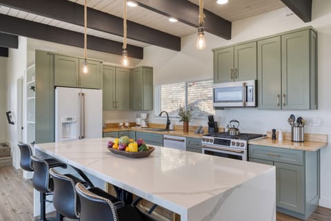 Gather around the spacious kitchen island—perfect for prepping, dining, and making memories!