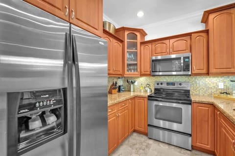 Enjoy a well-equipped kitchen with modern appliances and ample space to prepare meals. A warm and inviting setting for cooking or casual dining.