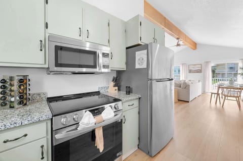Fully stocked kitchen (#1) with all your cooking needs - dinnerware, glassware, cooking pots/pans, seasonings, and cleaning supplies. This is the kitchen located upstairs.