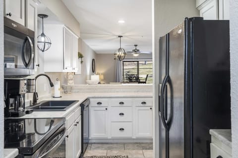 Unit 3’s airy, open kitchen offers ample space & every home comfort