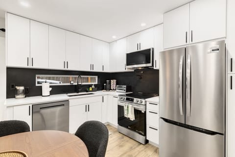 Spacious kitchen with clean layout. Easy flow from prep to table.