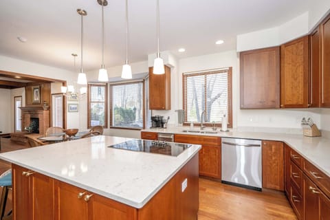 The chic, open kitchen offers ample space & every home comfort