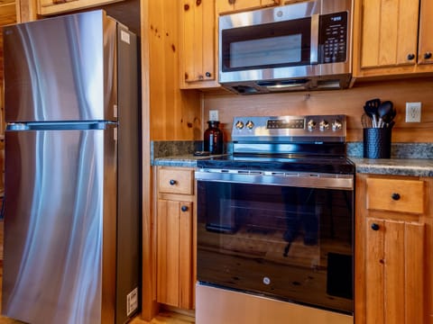 Prepare delicious meals with ease in our fully equipped kitchen featuring brand new stainless steel appliances.