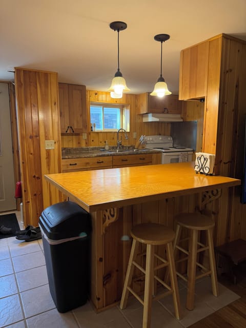 Large sit at counter with stools for additional seating. 