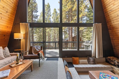 Gorgeously decorated and updated interior living space with floor to ceiling windows.