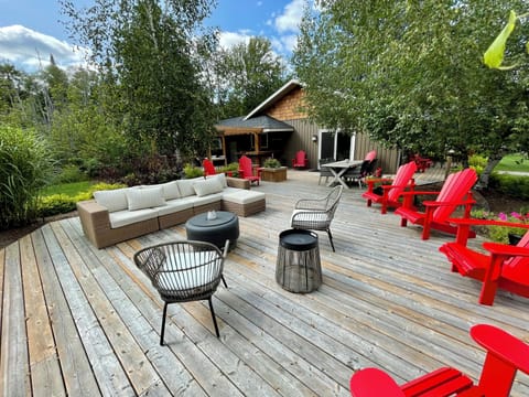 Backyard deck and seating area is great to sit, relax and enjoy outdoors. 