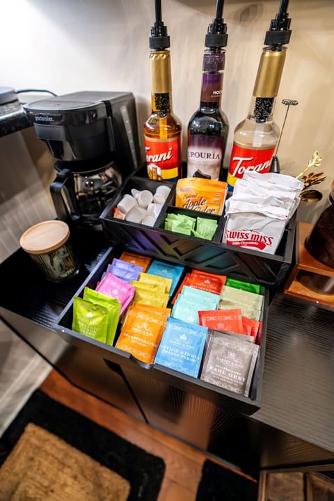 Stylish, well-stocked coffee bar with K-pod, Nespresso, drip, and French press — plus full selection of teas, artisan syrups, and sweet sips for every guest