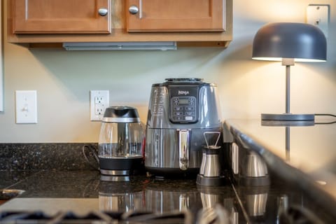 Smart, guest-friendly appliances await — like a Ninja air fryer and electric tea kettle, making meals easy and effortless
