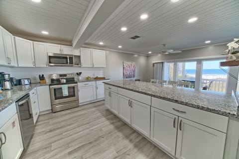 This dreamy kitchen blends ocean views, modern style, and tons of counter space.