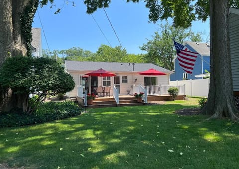 Back of House (nice grassy yard with a deck, patio furniture and private parking area)