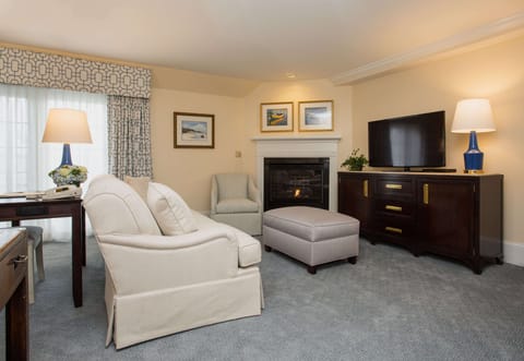 A cozy fireside nook with elegant details, perfect for both work and relaxation.