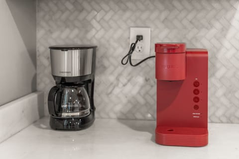 coffee pot, Keurig with assorted coffees and creamers, granulated sugar