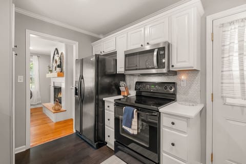 Kitchen, refrigerator with icemaker and water, microwave, electric stovetop