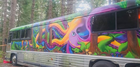 Portland artist Firekat's work of art on our bus — a vehicle of journey, adaptabilitiy & transition