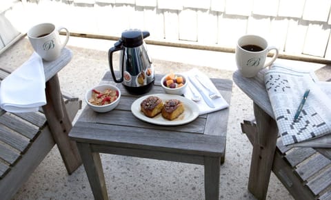Start your day with a peaceful breakfast on the balcony, complete with fresh coffee and pastries.