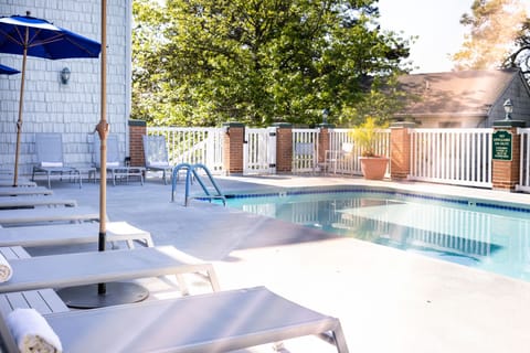 Tranquil waters and inviting lounge chairs set the scene for a peaceful retreat just steps from the shore.