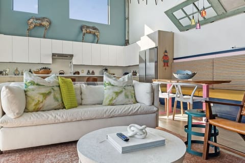 World of whimsy at Pie Town Emporium- Open concept living/dining/kitchen spaces. Enjoy extra sleeping space on the sofa bed.