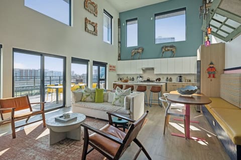 World of whimsy at Pie Town Emporium- Open concept living/dining/kitchen spaces. Enjoy extra sleeping space on the sofa bed.