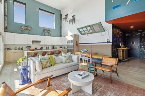 World of whimsy at Pie Town Emporium- Open concept living/dining/kitchen spaces. Enjoy extra sleeping space on the sofa bed.