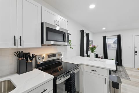 “Sleek & Functional Kitchen Setup”
Whip up your favorite meals with modern appliances, a full knife set, and ample counter space — all in a clean, stylish design.