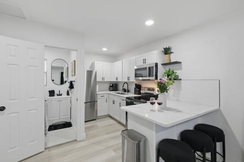 “Bright, Fully Stocked Kitchen”
