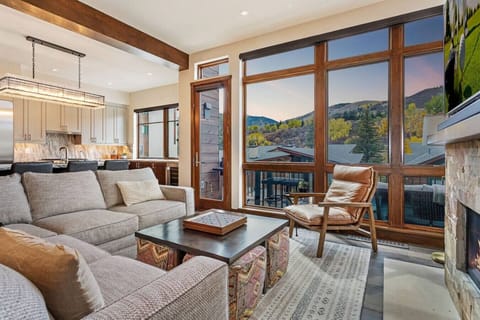 Spacious Living Room with Comfy Seating, Spectacular Floor to Ceiling Views, Gas Fireplace and Large Smart TV