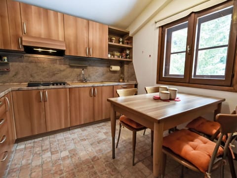 Furniture, Wood, Interior Design, Flooring, Kitchen, Cabinetry, Floor, Room, Major Appliance, Cupboard