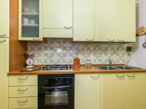 Furniture, Wood, Interior Design, Flooring, Kitchen, Cabinetry, Floor, Room, Major Appliance, Cupboard