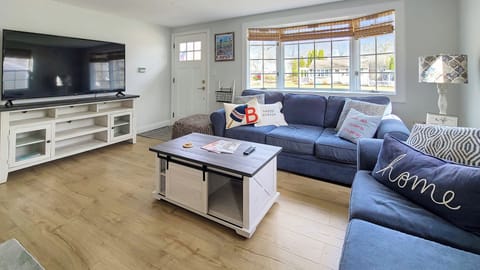 Living room with comfortable seating and flat screen TV